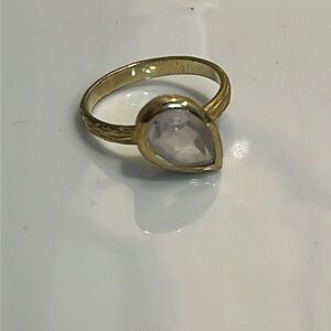 Gold tone Ring size 6.75 with light pink stone